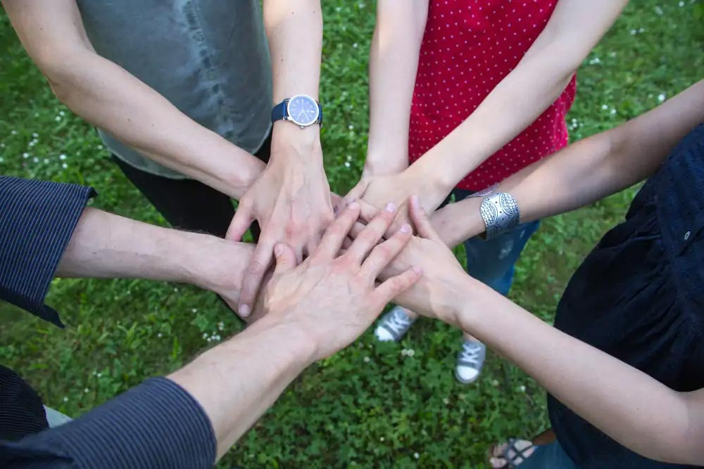 Hands holding each other.