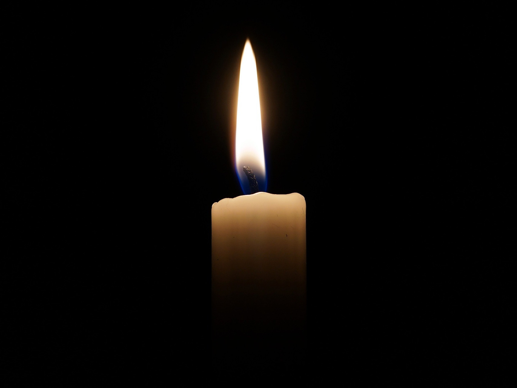 Symbolic image candle in the dark